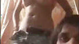 Desi Randi shows her tits and pussy