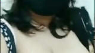 Desi aunt with big tits presses her melons