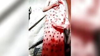 Beautiful Desi slut takes off her red sari to show off her slender body